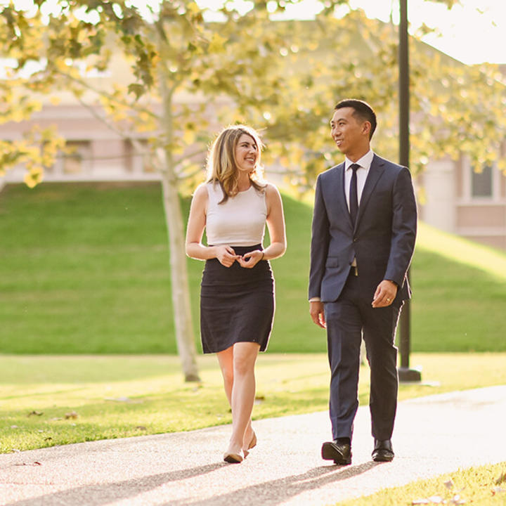 Two Professional MBA students outside McNair Hall