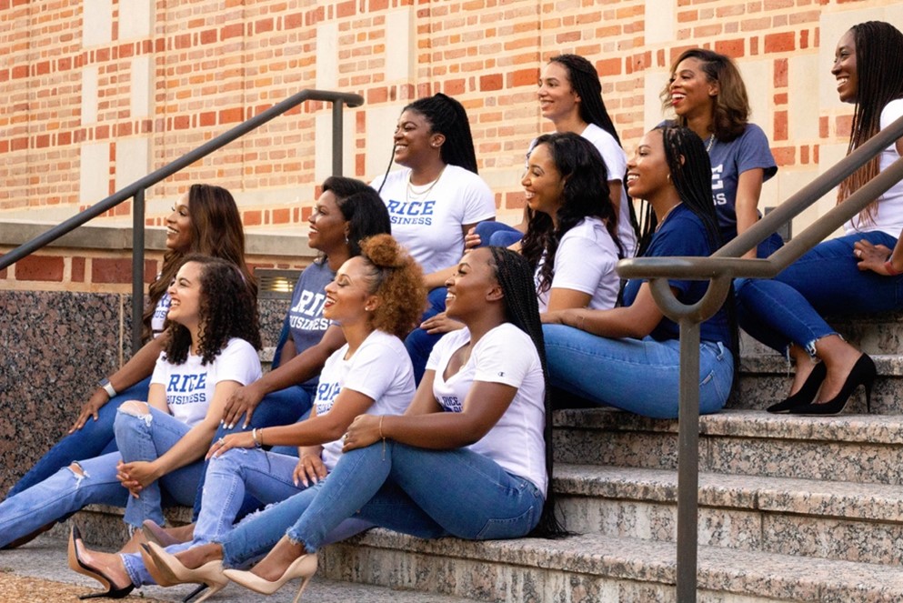 Ashley Henry and club members on stairs