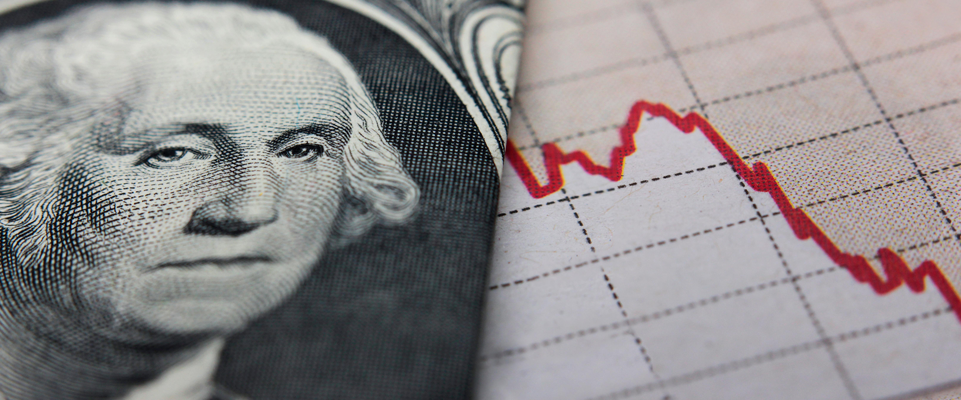 Dollar bill next to red ticker line