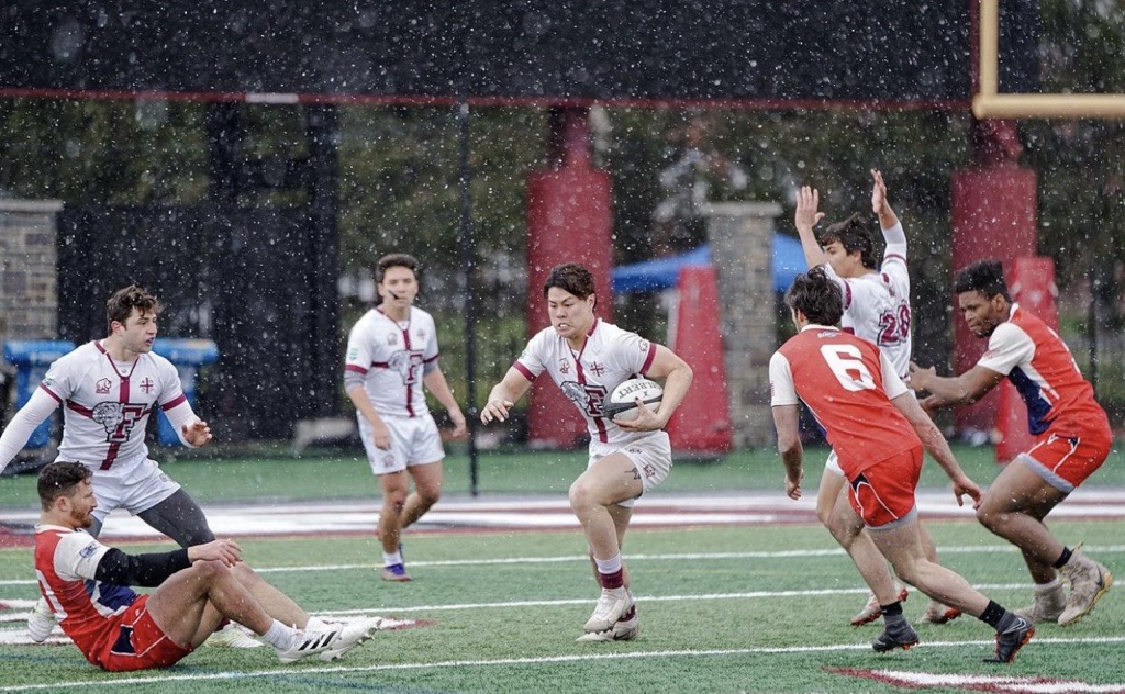 Victor playing rugby at Fordham