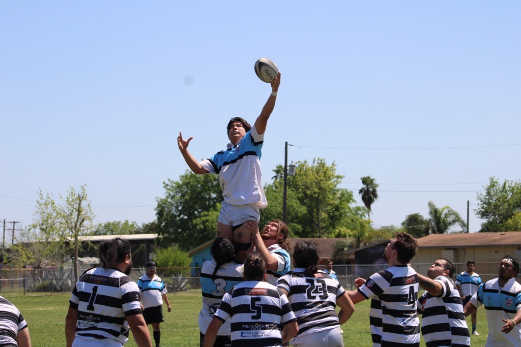 Victor playing rugby at Strake Jesuit