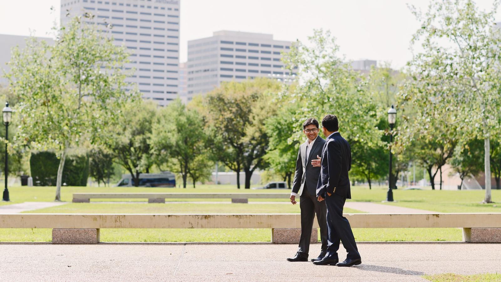 Two professors walking and talking