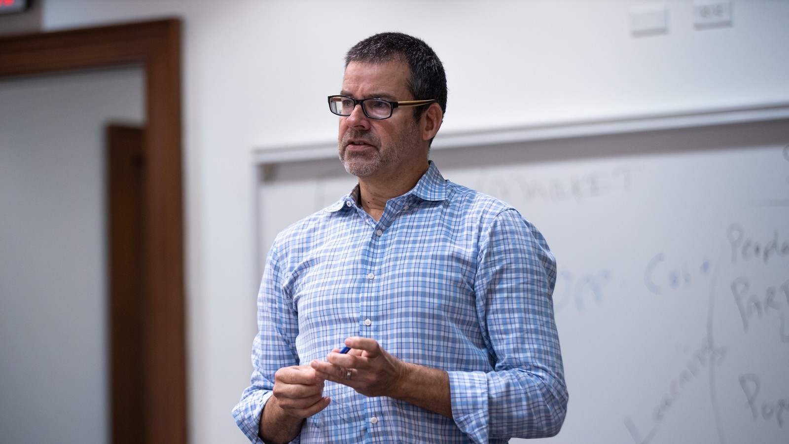 Professor Doug Schuler teaching in class