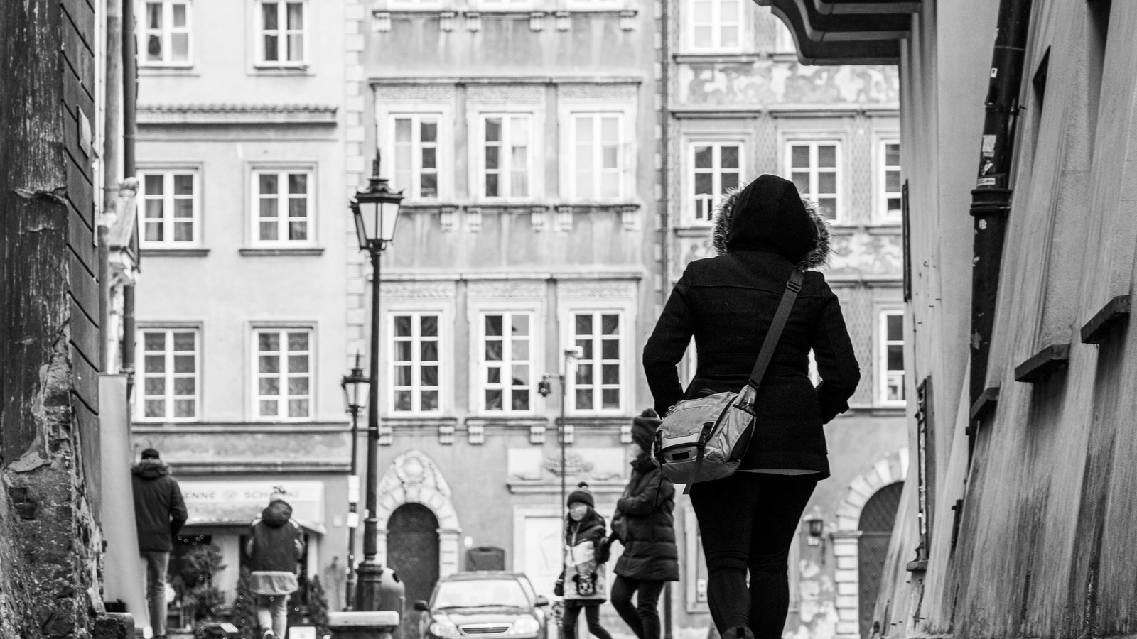 B&W photo of woman on street