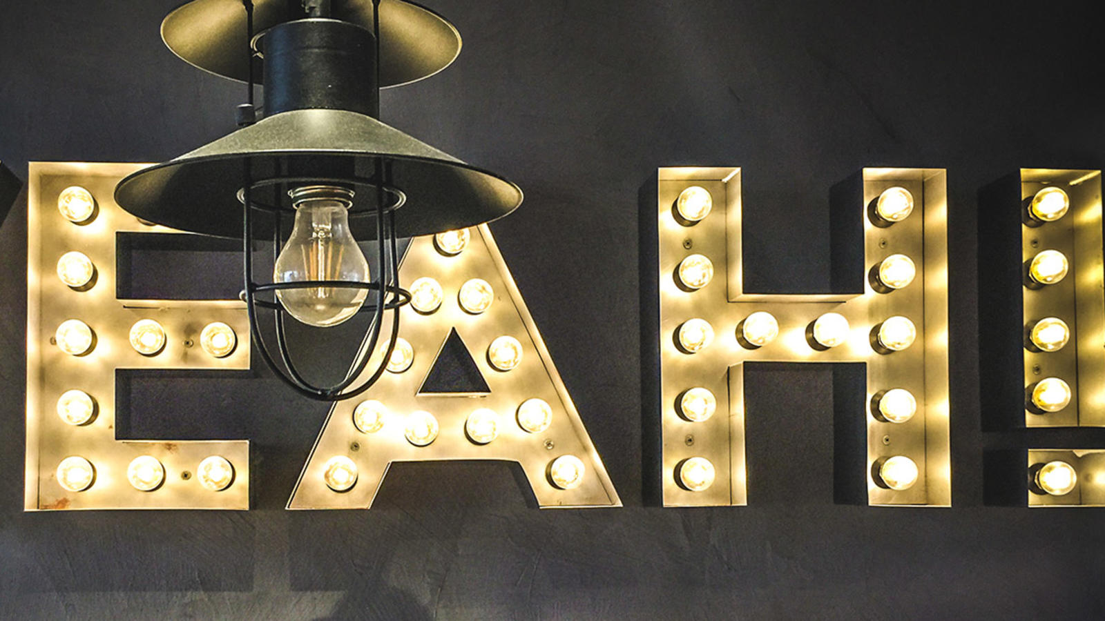 Light up sign saying "yeah" with three exclamation points