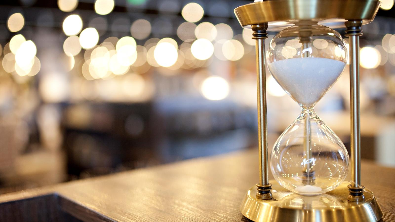 Gold hourglass on a counter