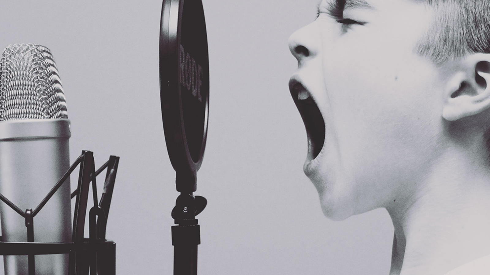 A child screaming into a microphone