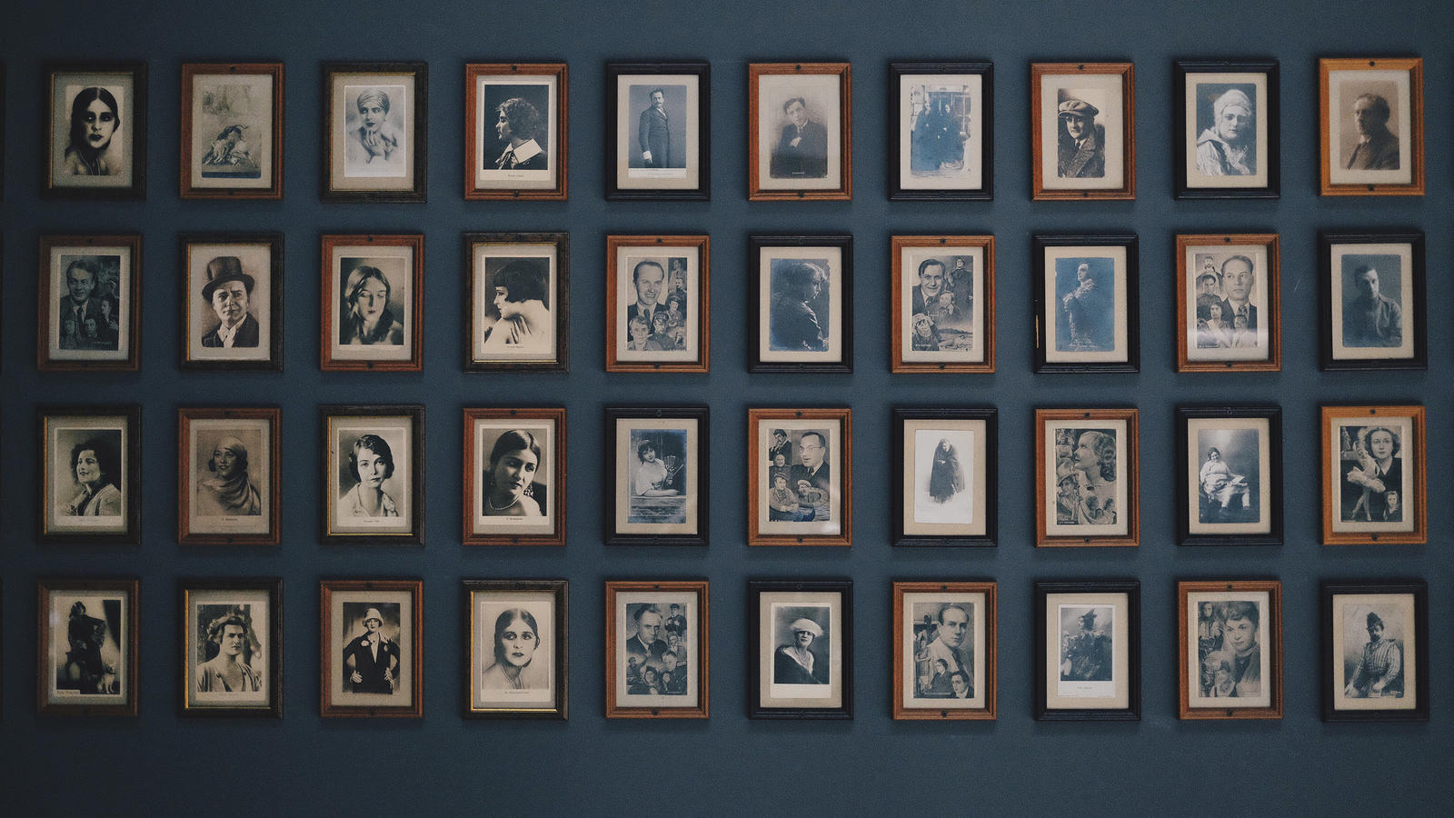 Blue wall with old portraits