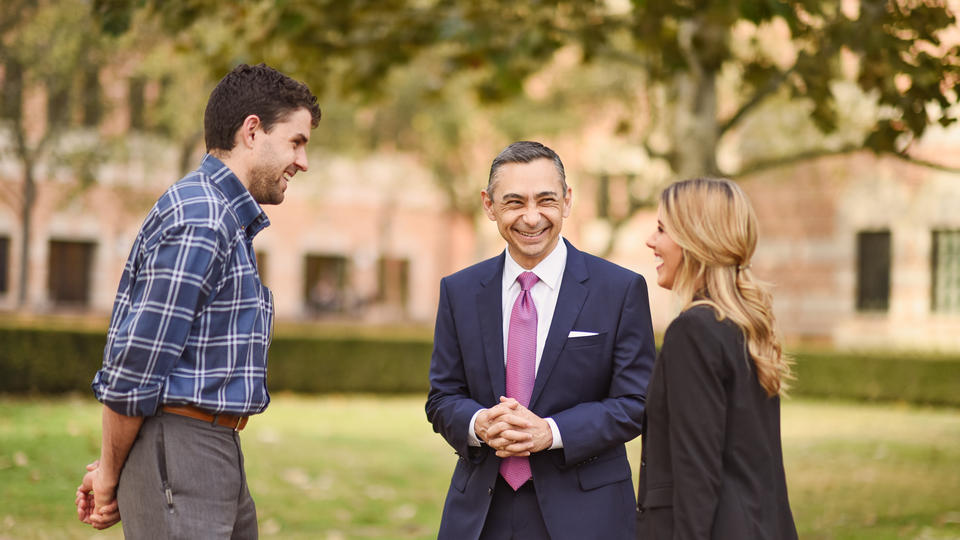 Dean Rodriguez speaking with students