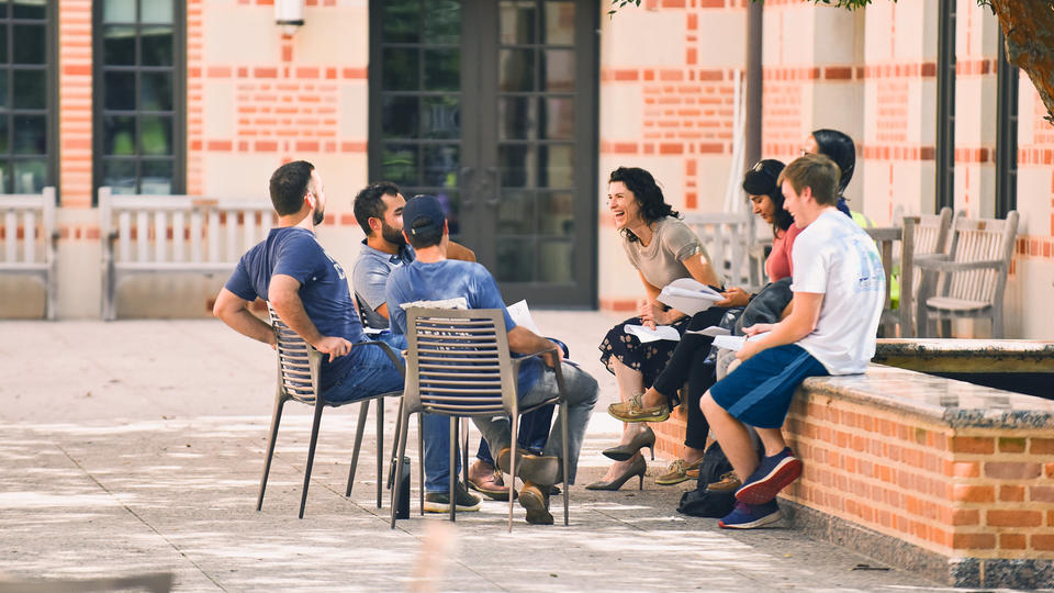 Group of students with professor outside