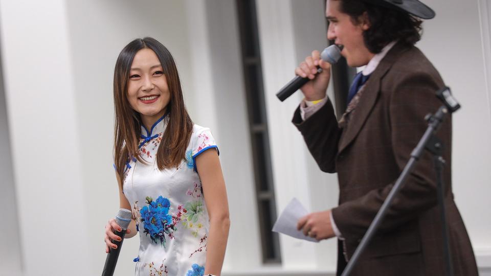 female student and male student presenting at international partio