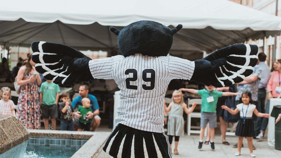 Mascot interacting with children at family partio