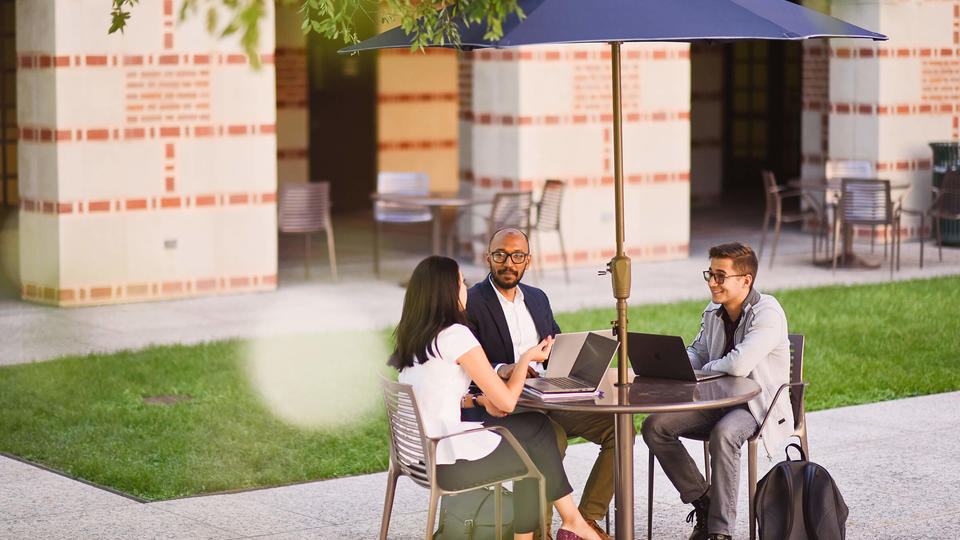 Students at Table in Woodson Courtyard