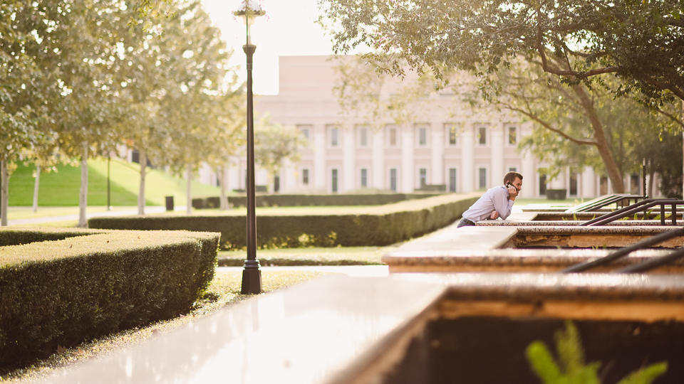 Man talking on the phone outside