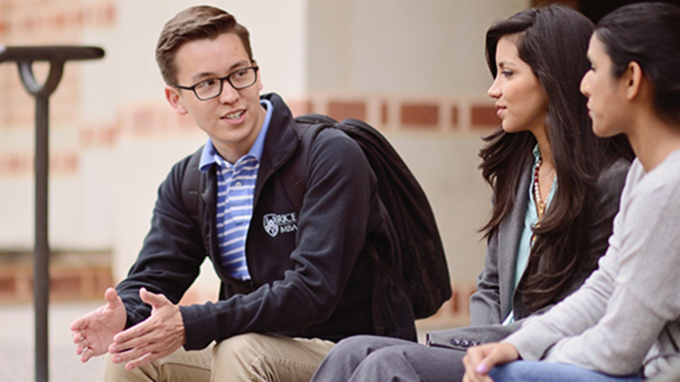 Three Rice MBA students outside