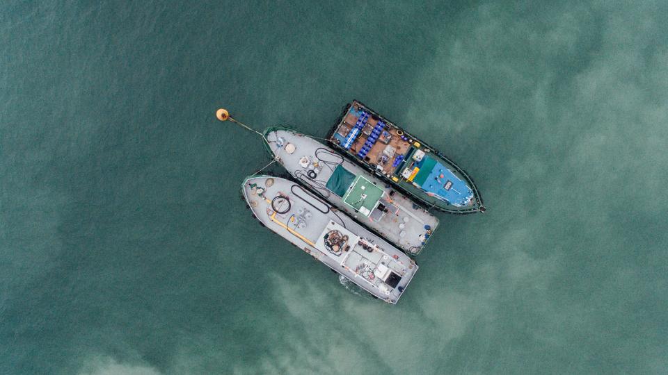 3 container ships in open water