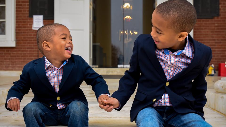 Two boys holding hands