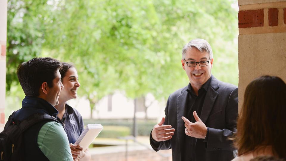 Undergraduate Business Major - Alex Butler with students outside