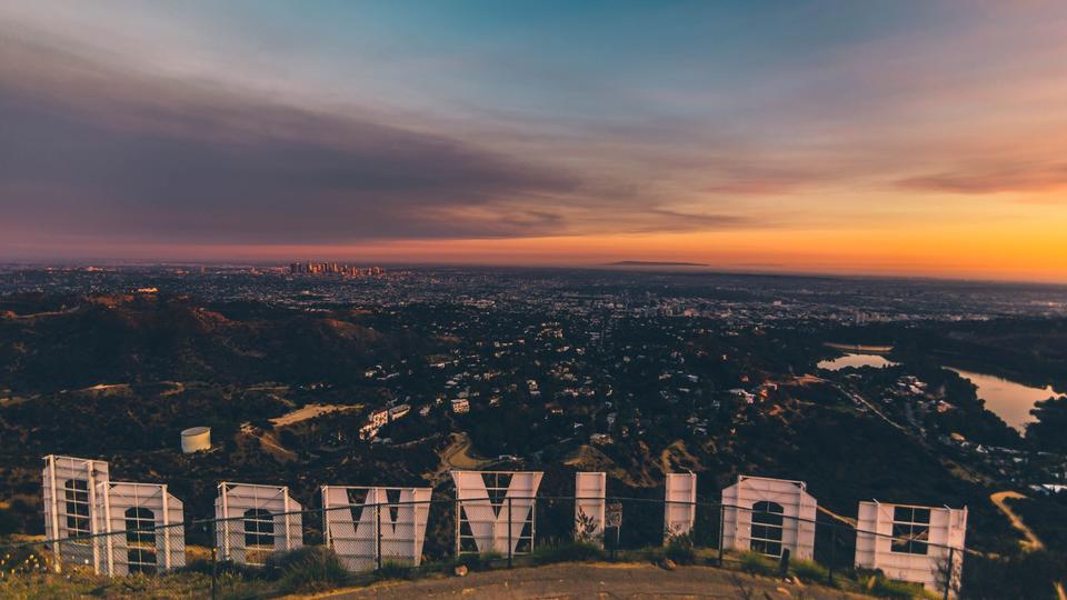 View of Los Angeles skyline during sunset from behind the Hollywood Sign