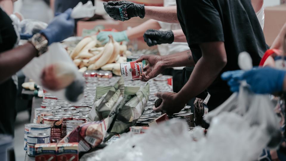 Hands putting food in bags