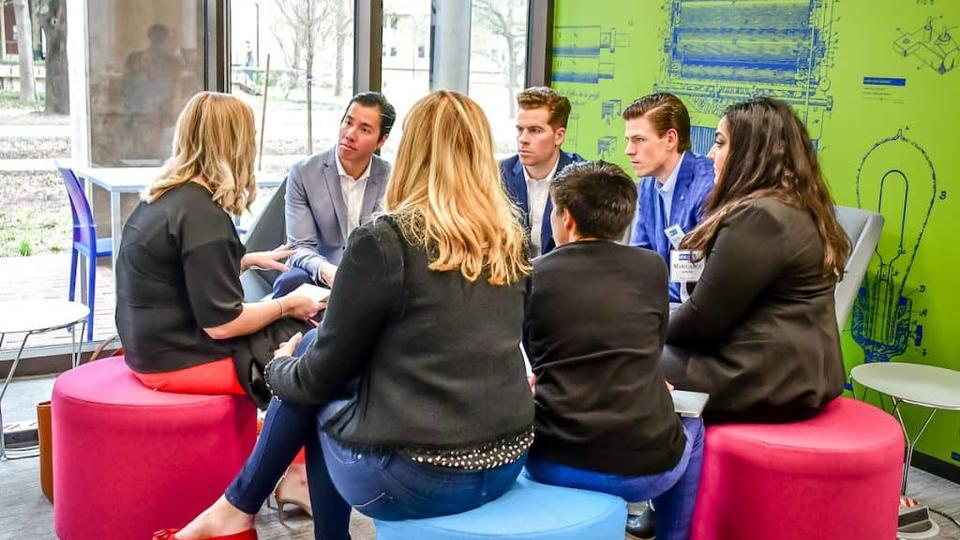 Rice MBA students in a group discussion in Lilie Lab