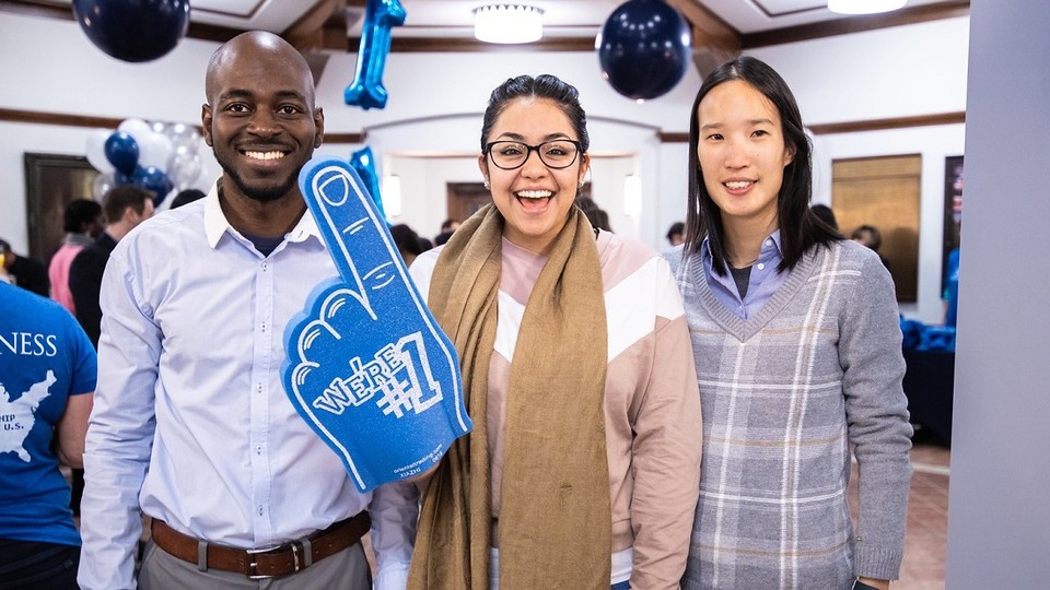 Three Rice MBA students showcasing Rice’s #1 entrepreneurship rank using hand foam