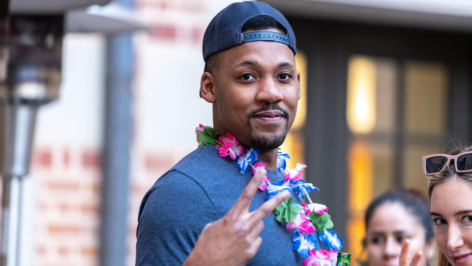 Student smiling doing peace sign
