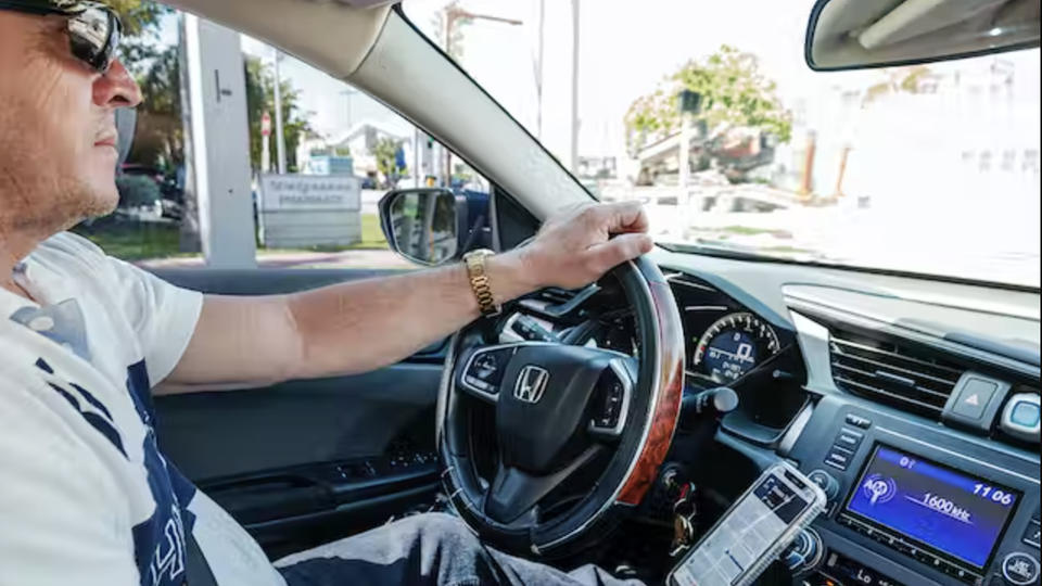 male driving a car