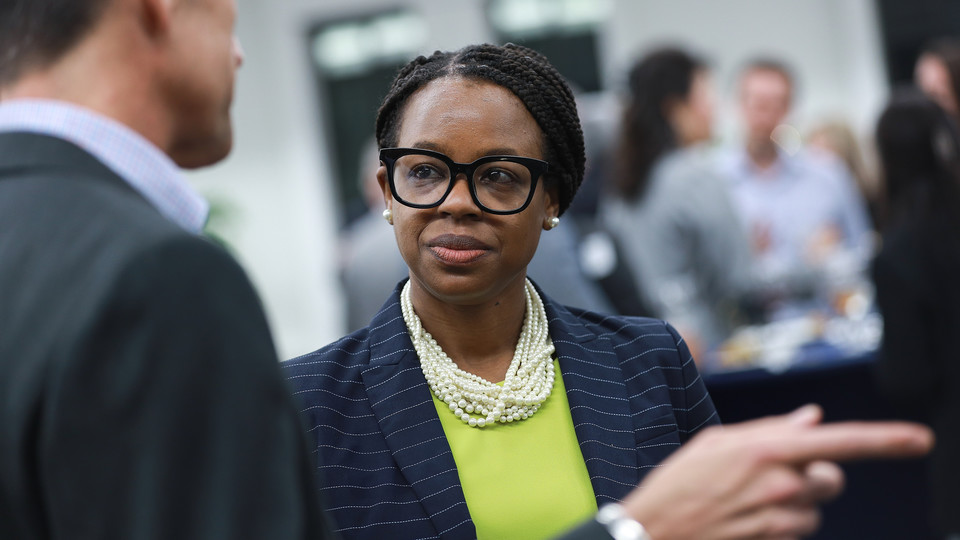woman in a suit networking at Professional MBA Networking and Leadership