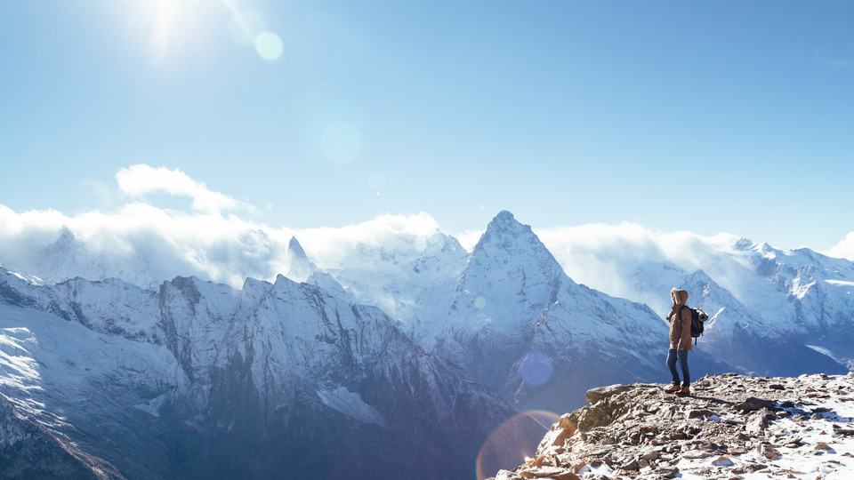 Person at the top of a mountain