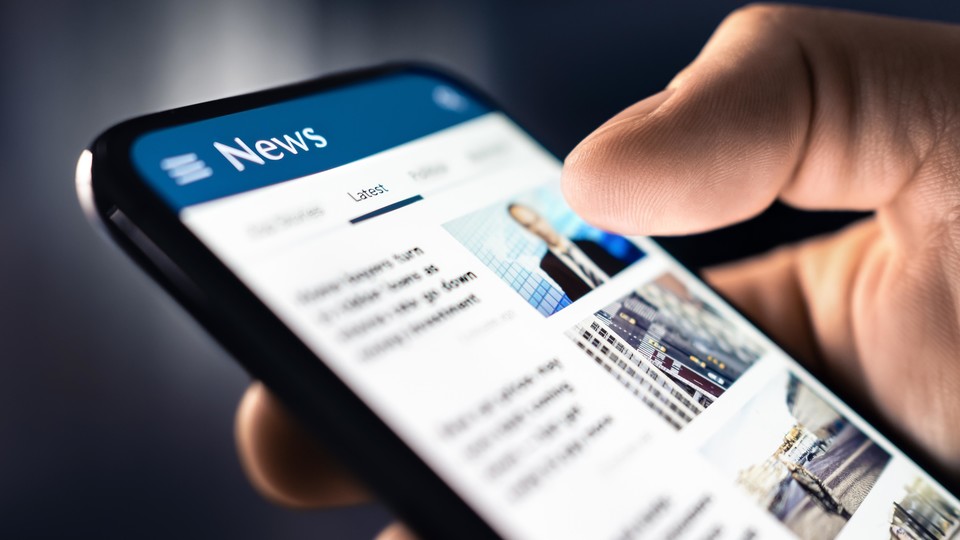 Phone with news app open