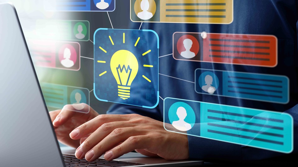 Person at laptop showing bubbles of messages