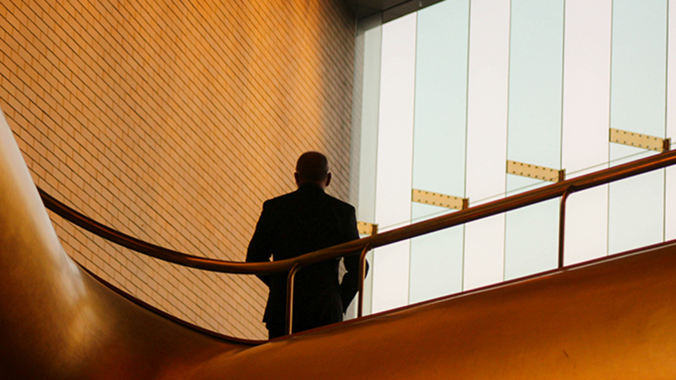 Man standing in a large building space