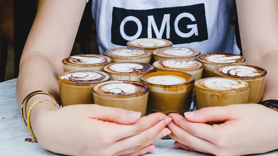Future of US energy industry Woman holding several cups of coffee
