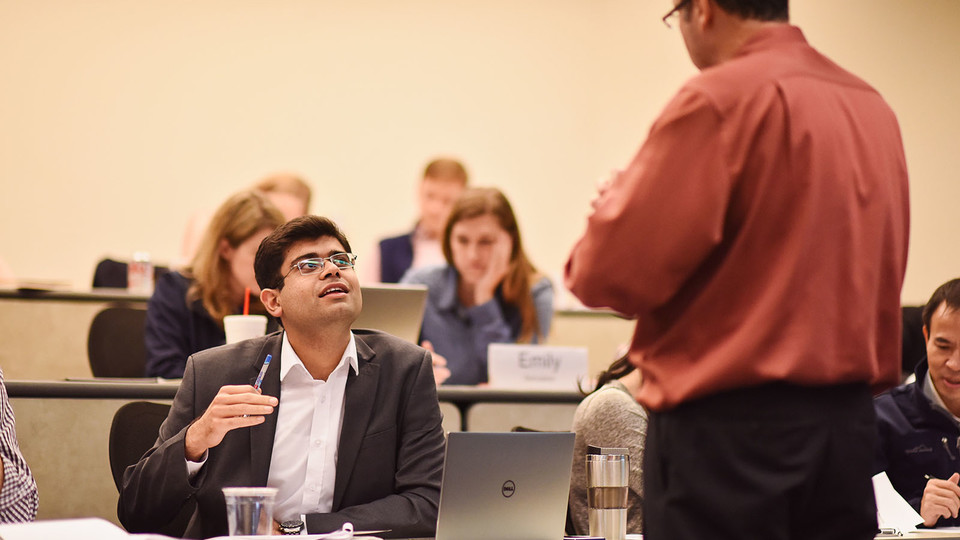 Professor interacting with a student during leadership and team coaching