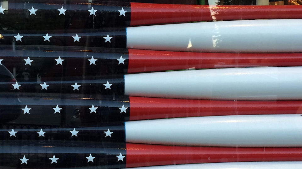 Playing The Long Game U.S. flag made up of painted baseball bats.
