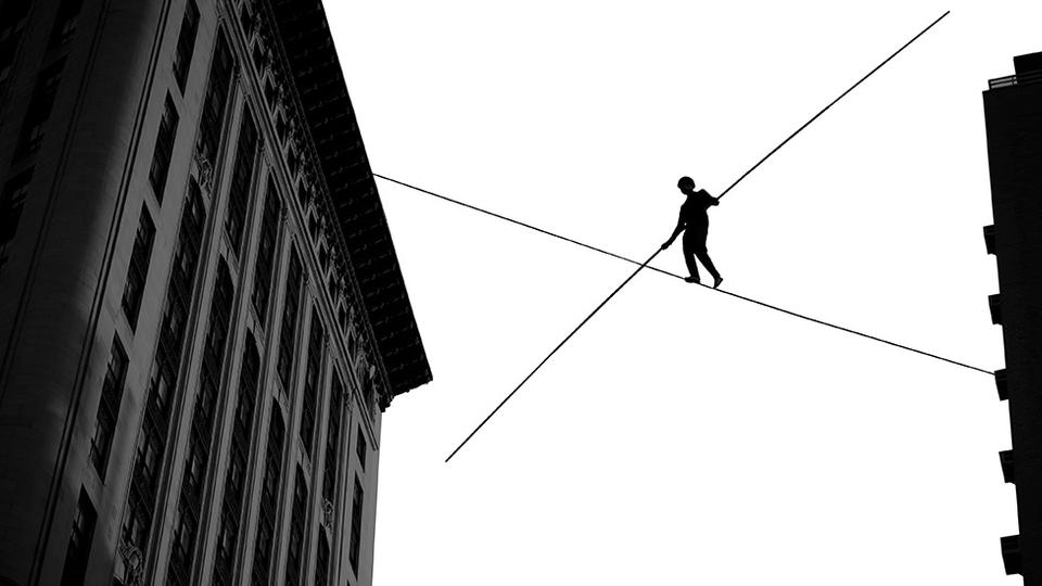 Man walking on a tightrope