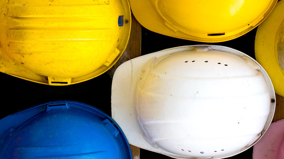 We Work Photo of hardhats taken from above.