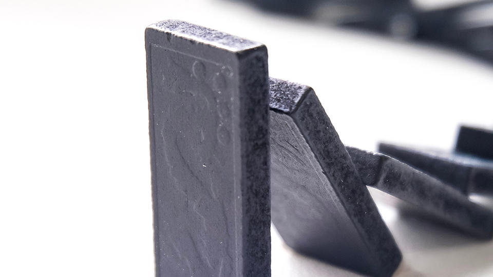 Black dominoes falling