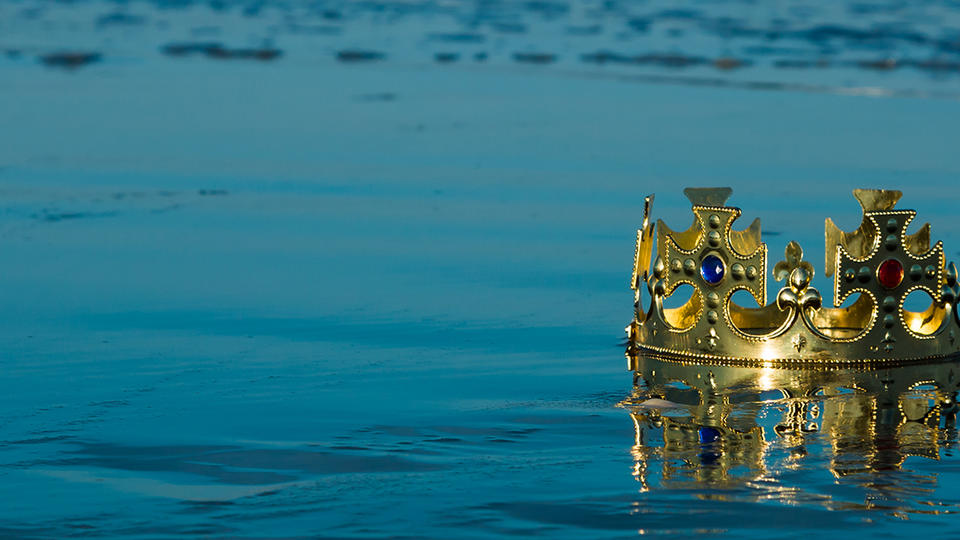Crown washed up on beach shore