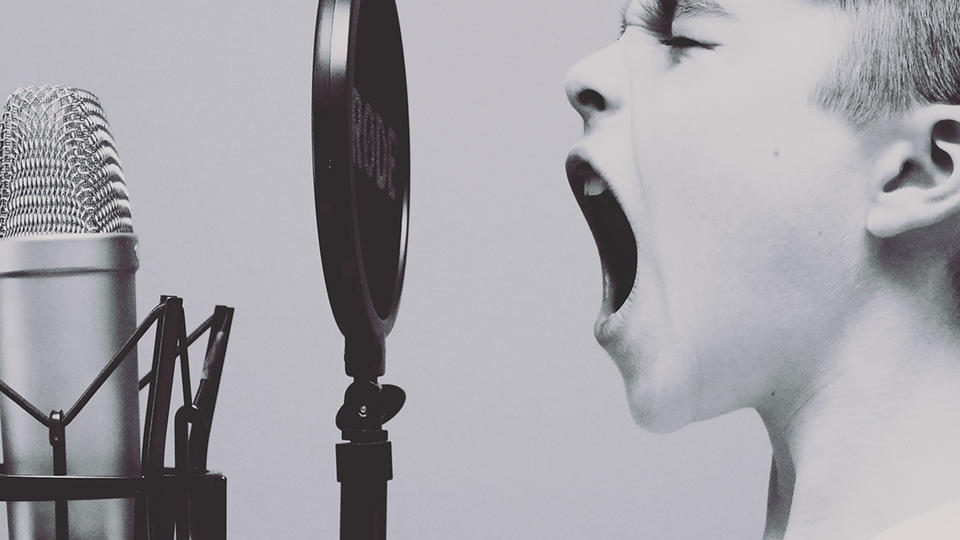A child screaming into a microphone