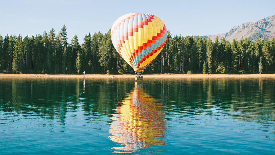 Air balloon near a lake. 