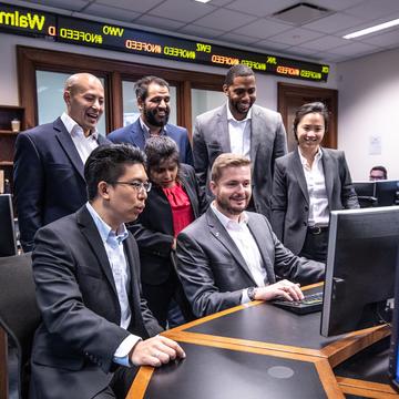 Group of students working in the rice business finance center