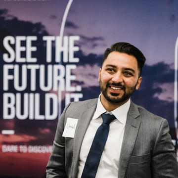 Male student in suit at Rice Energy Finance Summit