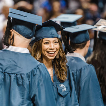 Female graduate smiling at investiture
