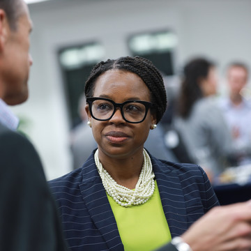 a woman in a suit networking