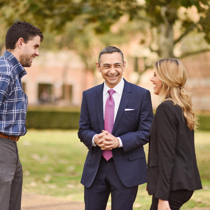 Dean Rodriguez speaking with students