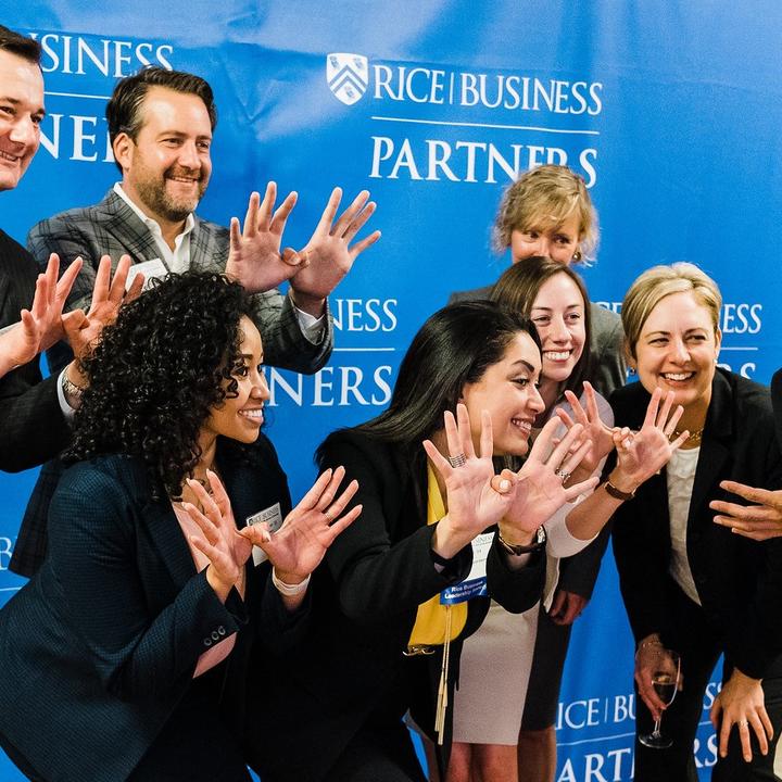 Rice Business Partners Owl Hands Team Photo