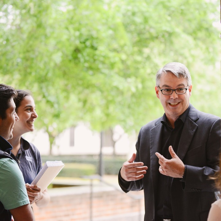 Undergraduate Business Major - Alex Butler with students outside
