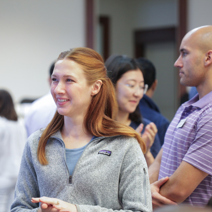 A female MBA student networking before class